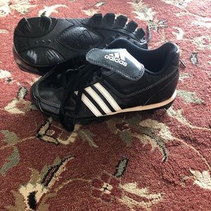 Adidas cleats with some wear